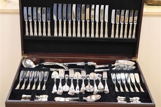 A canteen of Kings pattern silver plated cutlery in a mahogany free-standing canteen.